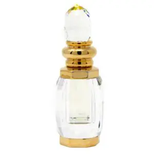 Elegant glass perfume bottle with gold accents and a clear crystal-like stopper.