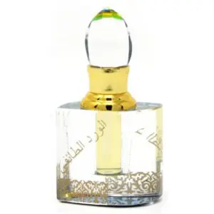 Elegant glass perfume bottle with gold accents and a decorative stopper.