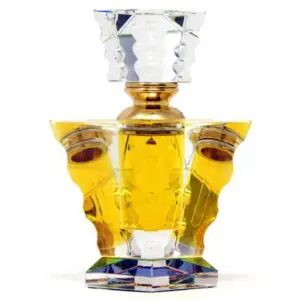 Ornate golden perfume bottle with a crystal stopper and intricate design.