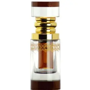 A small vial containing a brown substance with gold-colored details.