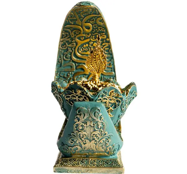 Ornate turquoise and gold decorative incense holder.