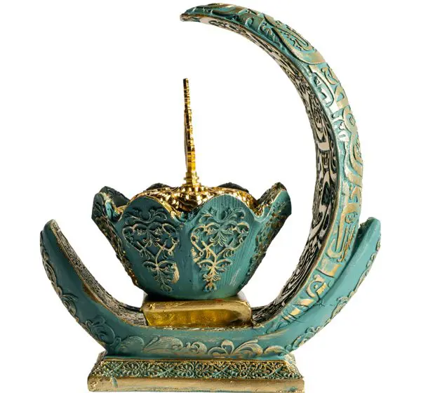 Ornate teal crescent and floral sculpture.
