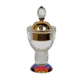Crystal perfume bottle with gold accents.