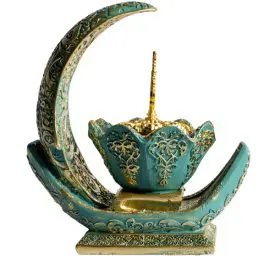 Decorative turquoise crescent with ornate detailing.