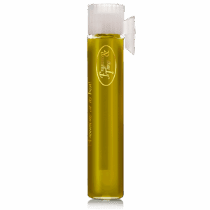 Tall glass of light beer with foam on top.