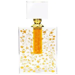 Elegant perfume bottle with golden floral design and amber liquid.