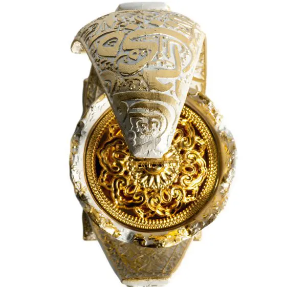 Ornate golden ring with an intricately engraved design and a serpent motif.
