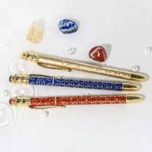 Decorative pens with gemstones and crystals.